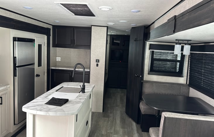 Kitchen and Dining Room includes coffee machine, mixing bowls, knifes, measuring cups, cups, coffee mugs, and some basic cleaning supplies