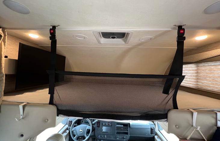 Built in safety net so children are safe while sleeping on the bunk above the captains chairs.