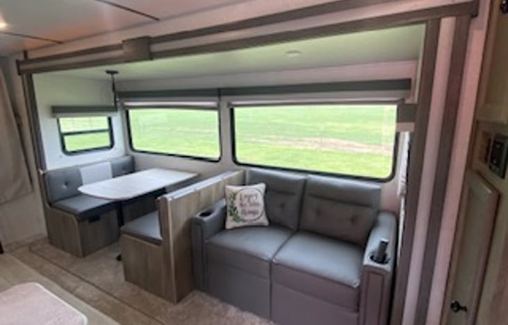 Dinning area and couch both make into beds.