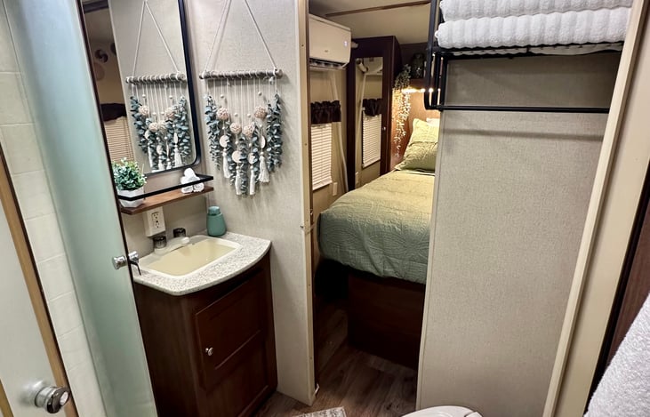 Bathroom is stocked with bath towels, hand towels, wash cloths and of course toilet paper