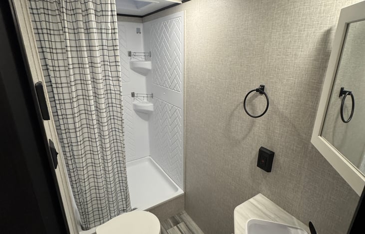 Bathroom with shower - On demand water heater with digital thermostat.