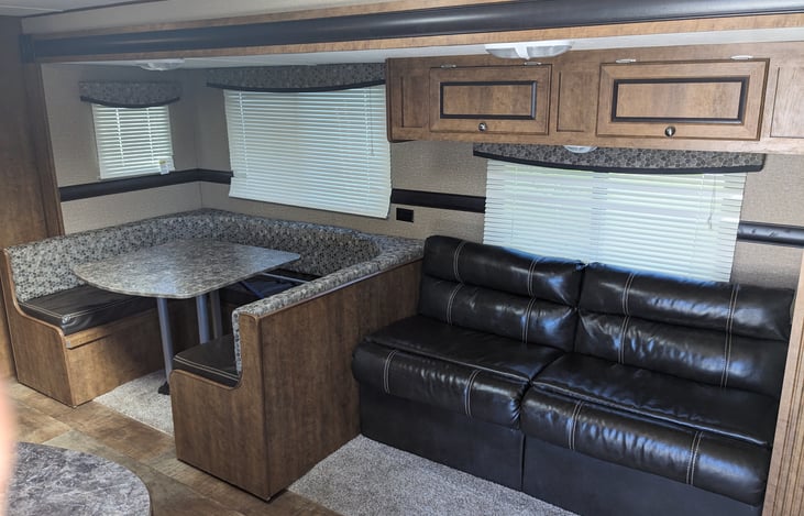 Dining table and jack knife couch. Both turn into beds.