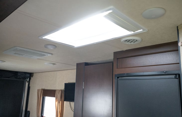 Wow!  Sky-Light in ceiling of kitchen area allows additional natural lighting into the camper.