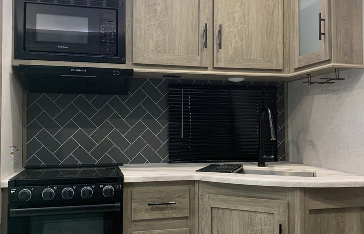 Close up of sink and stove area