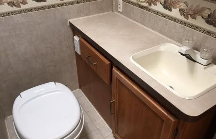 bathroom now has an upgraded porcelain toilet that is not pictured here.