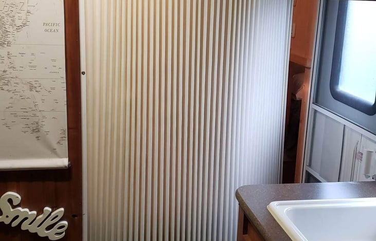 Sliding curtain closing off bedroom