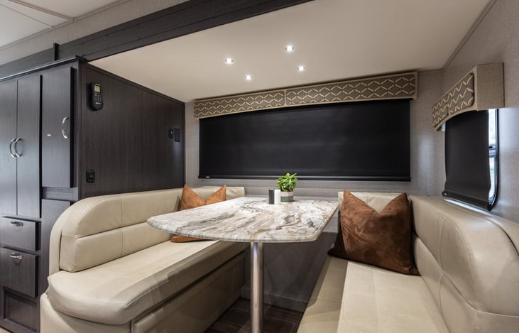 Dining area seats four adults comfortably. Two seat belts available for extra passengers.