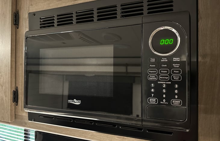 Microwave area that fits most full size plates.