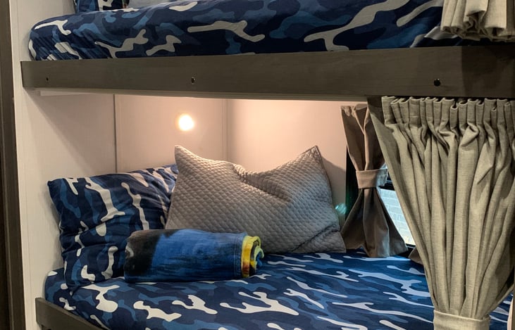 Bunks outfitted with Navy camo for all the lil’ sailors… (also available in Purple)