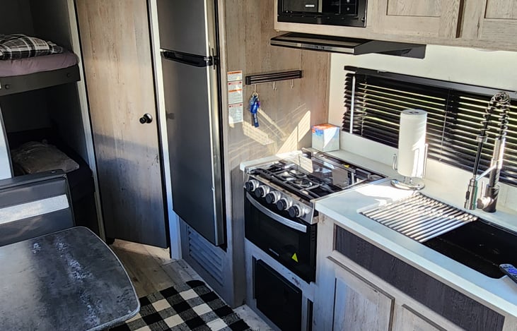 Kitchen area- Fridge is 12V that operates off the batteries.