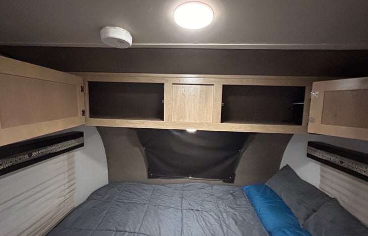 Storage over queen bed.