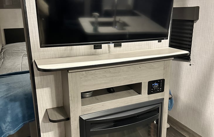 Electric fireplace with heater and smart tv