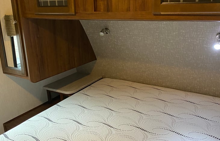 Queen bed with nightstands on each side