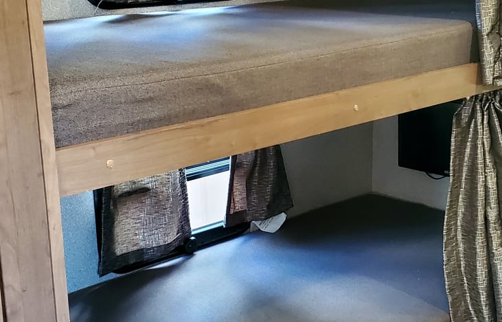 Bunk Beds, each has its own TV and curtain.