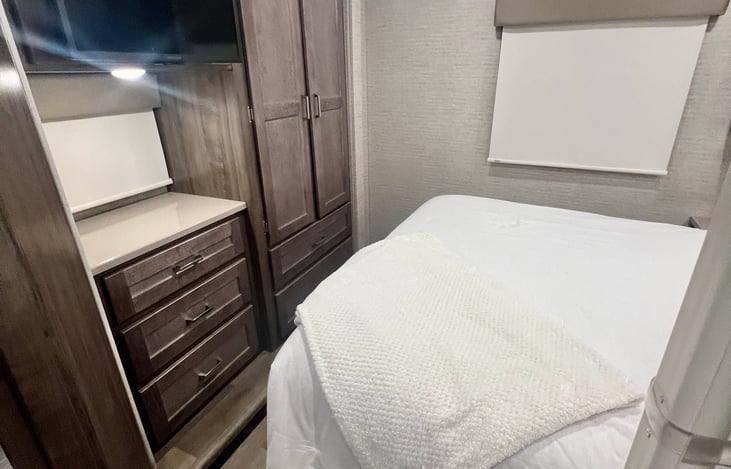 Large wardrobe for family. TV in master.