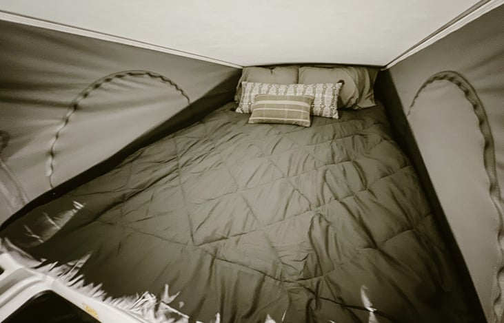 Upper sleeping area of pop top