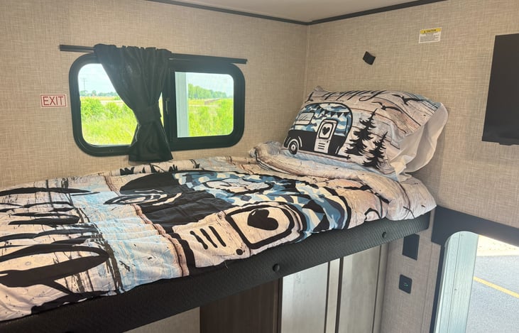 Twin bunk with bedding and pillow