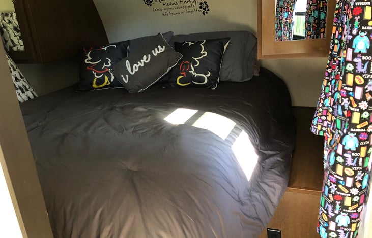 This bed is a queen pillow top comfort mattress that will easily fit 2 adults. Since this is something we use often we upgraded to a real, full sized queen. None of this small ‘trailer Queen’ business