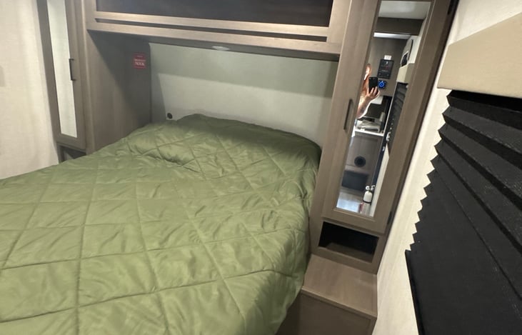 This cabinet contains shelves to lay clothes or other personal items on.