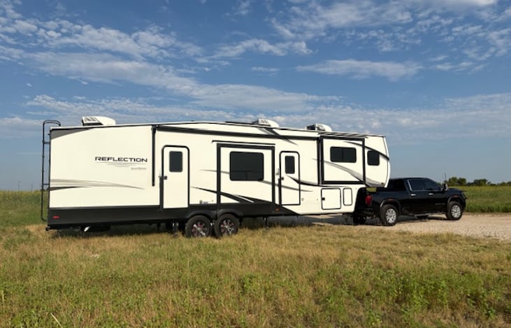 Adventure is calling!  This RV is all packed, hitched, and ready to bring home comfort and fun to it's next adventure-seeker.