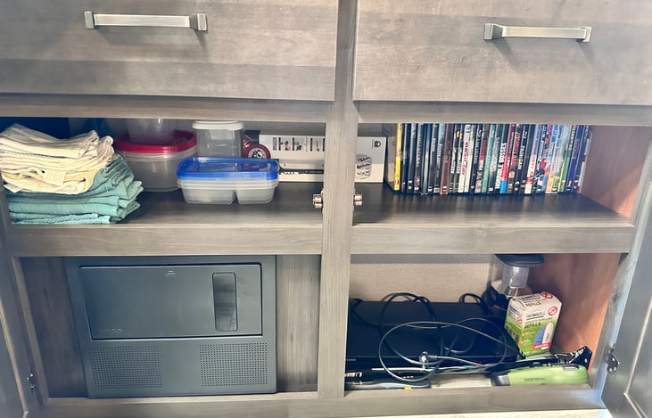 Dish towels/rags. Tupperware. DVD player and dvds.