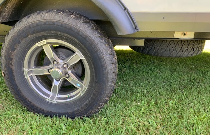 Rugged AT tires and full size spare. Extra ground clearance due to 3 5/8” lift