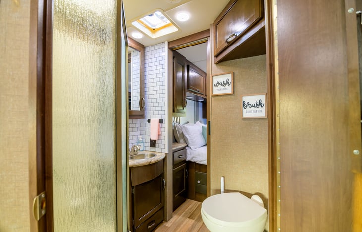 Bathroom offers great storage space, stand up shower and vanity.