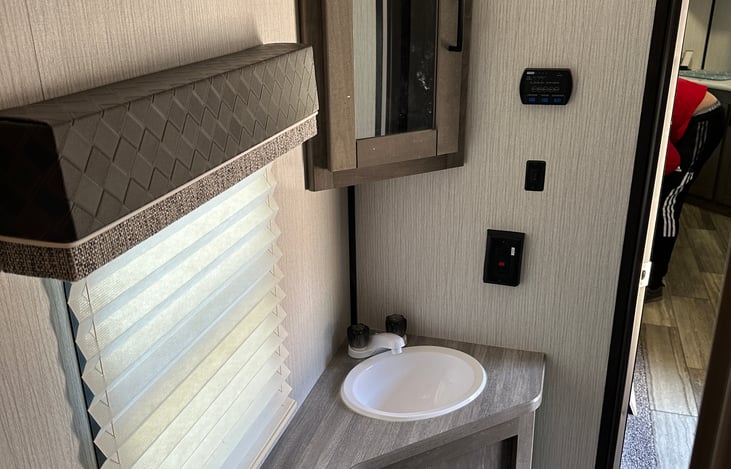 Bathroom sink with mirror vanity storage