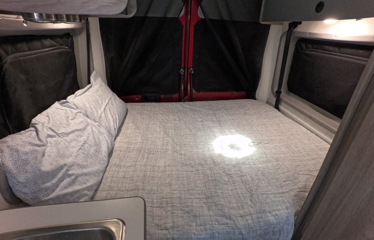 Queen size bed in the back with full privacy