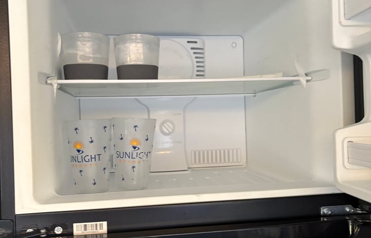 Freezer is ready to store food and has frozen cups for your favorite beer or whiskey