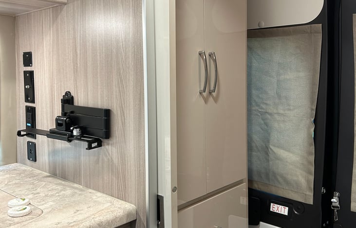 Tablet holder and wardrobe in wet bath