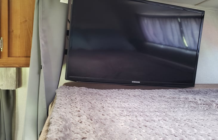 The TV in the loft bed will swivel, so you can enjoy a show while lounging in the recliners.