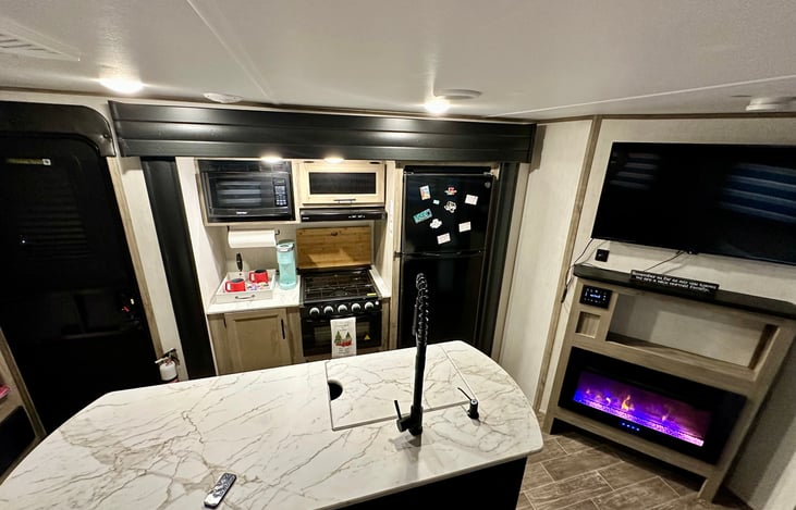 Island kitchen with fireplace