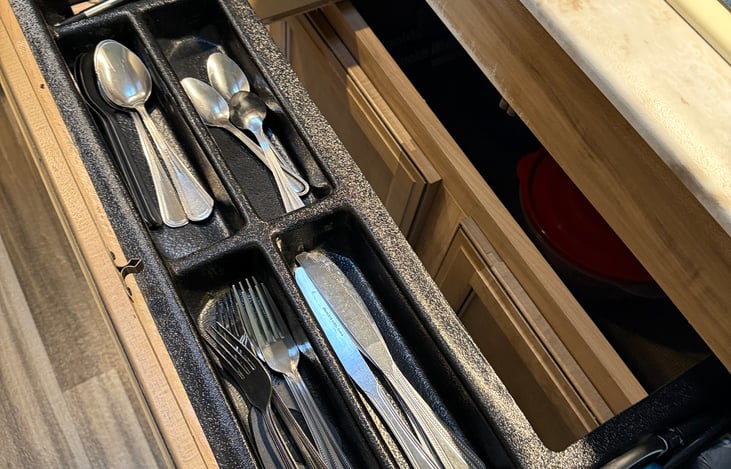 Kitchen stocked with basic utensils and silverware for easy meal prep during your stay.