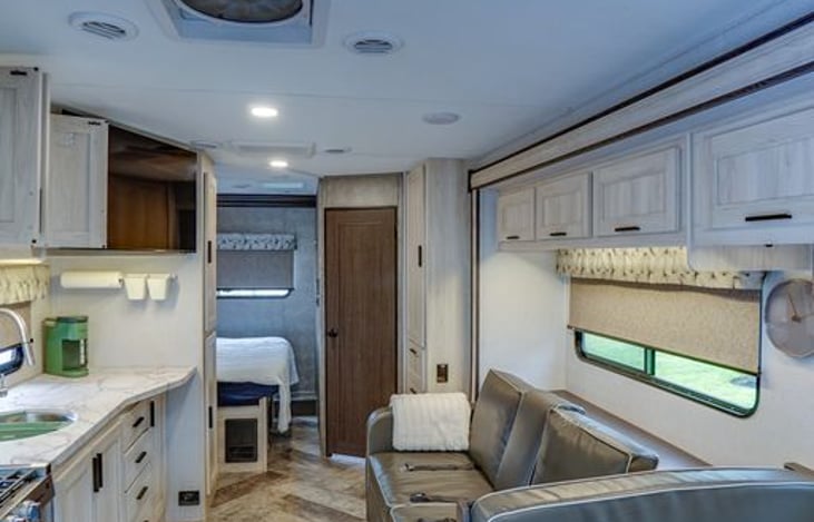 Lots of storage cabinets! Black out shades on all windows. Windows have screens! Air condition.