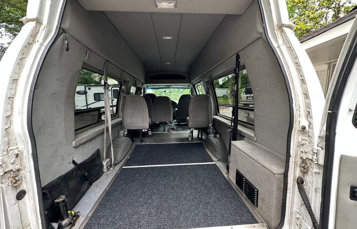 Rear doors open full with and latch to vehicle. Carpeted cargo space for gear protection or small mattress.