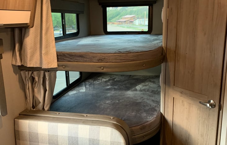 Bunk windows & door to bathroom.