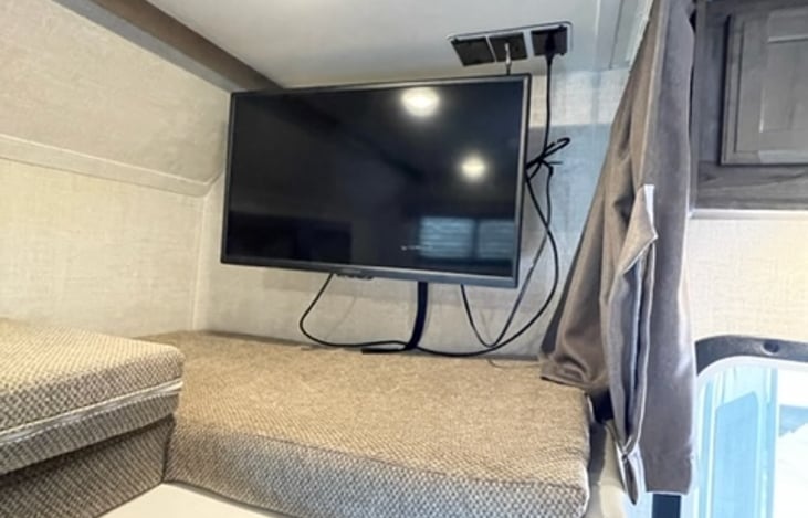 TV on a swing arm so it can be moved out to view once you are set up at your destination.