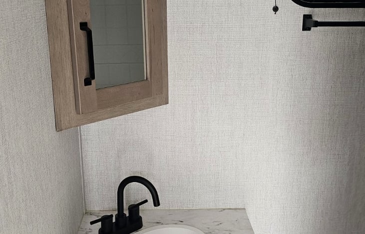 Bathroom vanity with sink and storage