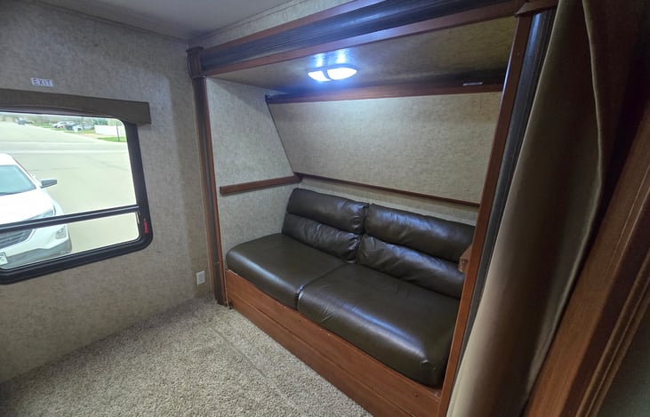 Top bunk Can fold up out of the way, so you can watch a movie on the couch!