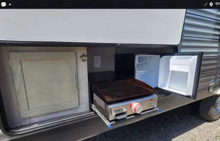 Outdoor kitchen. With griddle and mini fridge