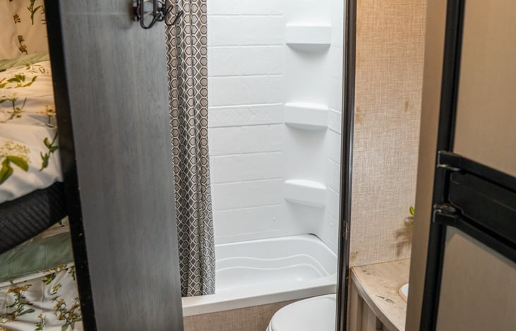 Tub shower combo perfect for little campers.  Vanity outside of bathroom door makes sharing the facilities a breeze.