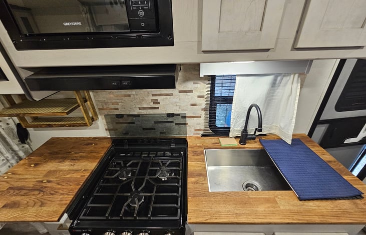 Fully equipped kitchen with real wood countertops