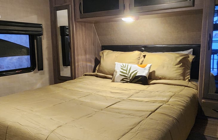 Queen size bed with closets and underbed storage. Bedding included.