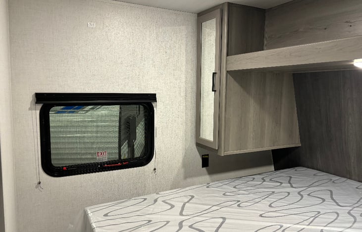 QUEEN FRONT ROOM STORAGE ON BOTH SIDES AND TOP OF BED