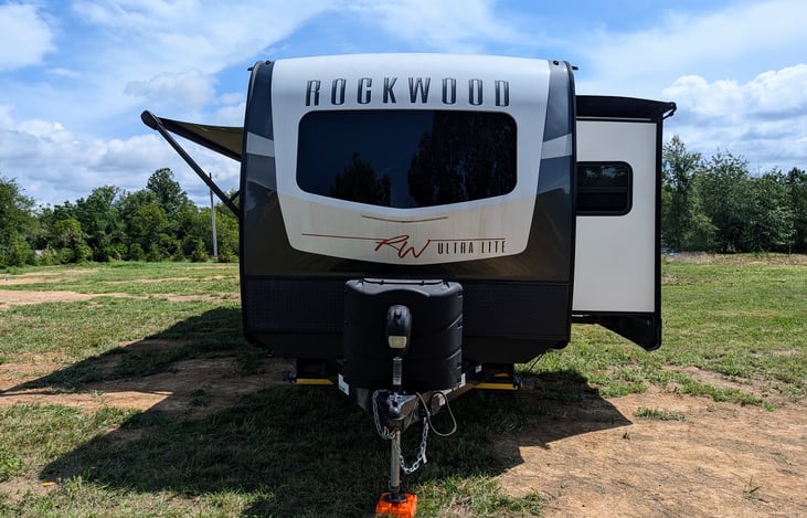 Luxury 35ft Rockwood Ultra Lite! Features dual slides, comfy recliners, private Queen suite with reading nook, full kitchen & outdoor grill setup. Windows throughout. Perfect glamping for up to 3!