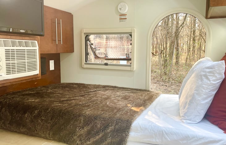Air conditioning for hot summer nights and a TV/DVD player for when the weather is not so hot.
