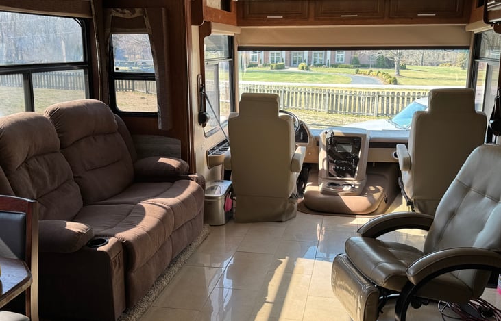 Living area. Captain and passenger's seats turn around for additional seating while parked.