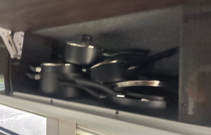 Overhead Storage area  currently with pots and pans (optional free of charge)