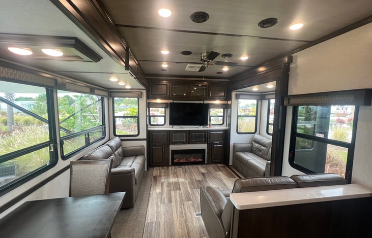 The living room has 2 electric recliners and the other 2 are sofa beds